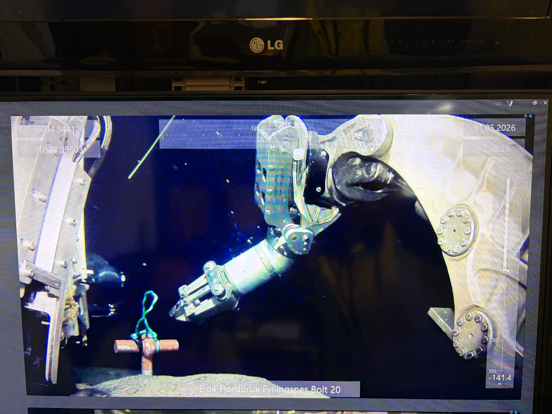 Subsea anchor bolt being installed in drilled bedrock by an ROV manipulator