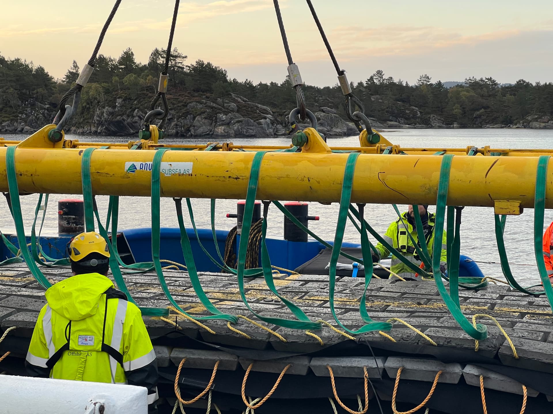 Crew rigging the concrete mattress for the power cable installation